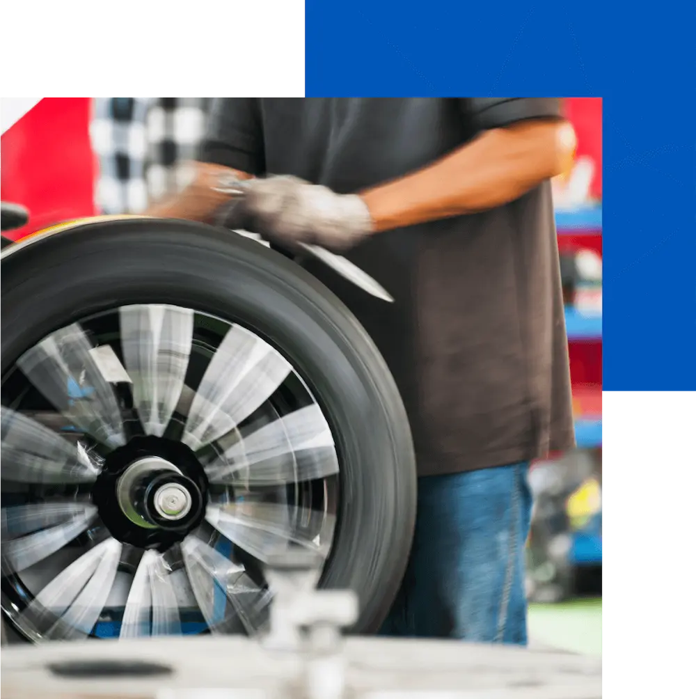 Man working to fix a tire in a tire repaid shop in Calgary